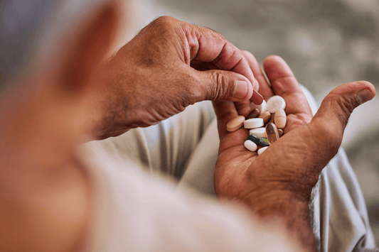 overdosing with vitamins in a man's hand
