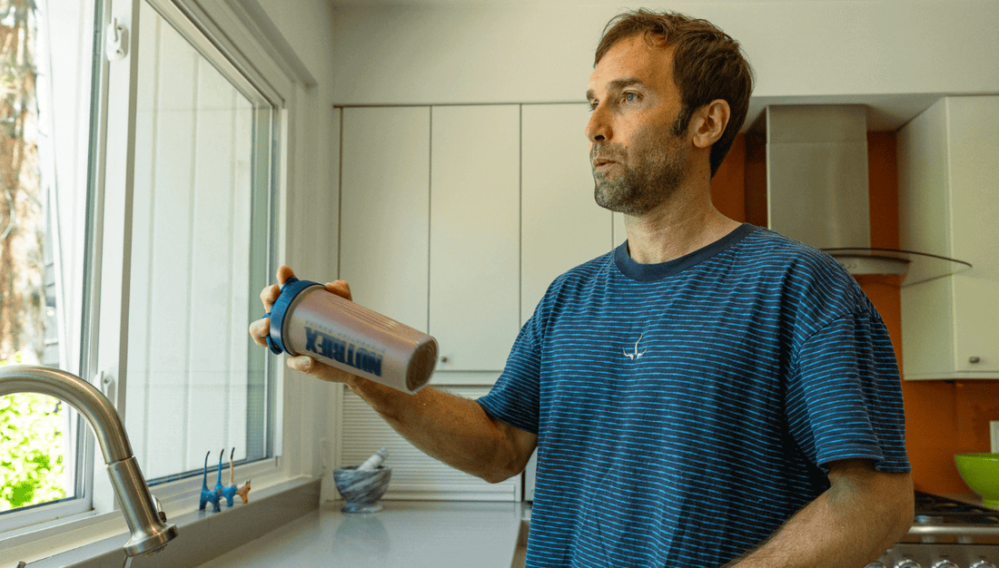 Chirs Sharma drinking a complete protein shake from Nutriex proteins+