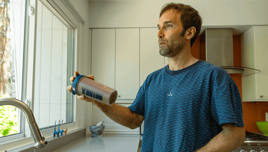 Chirs Sharma drinking a complete protein shake from Nutriex proteins+