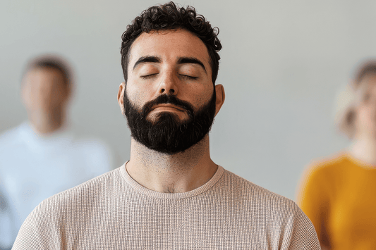 an image of a man meditating with eyes shut