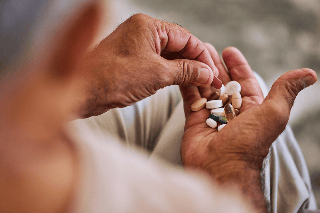 overdosing with vitamins in a man's hand