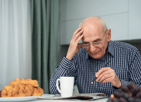 man concentrating while trying to do work